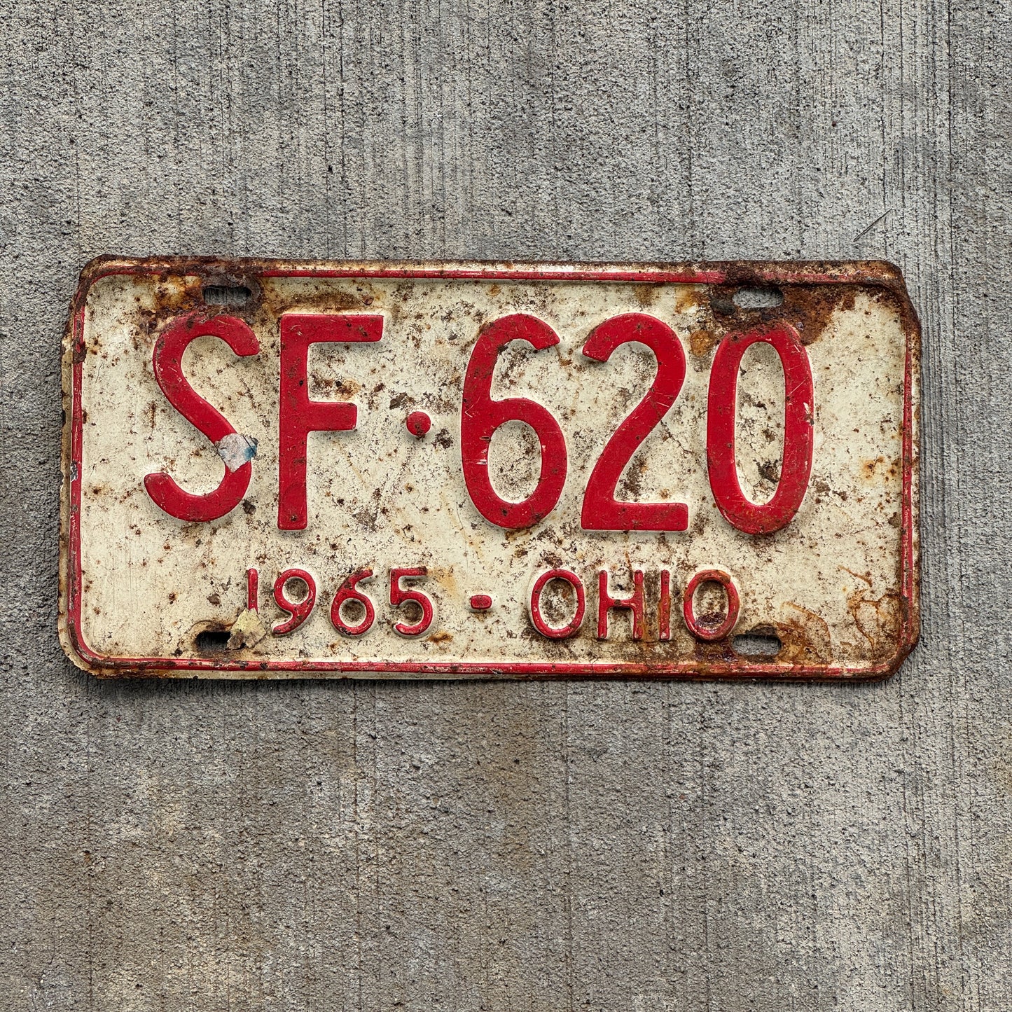 Photo of a 1965 Ohio License Plate Auto Tag Garage Decor Vintage SF 620 with original patina