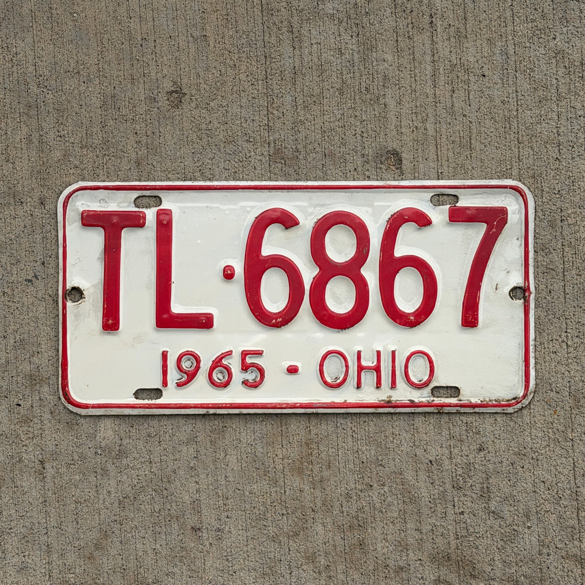Photo of a 1965 Ohio License Plate Auto Tag Garage Decor Vintage TL 6867 with original patina