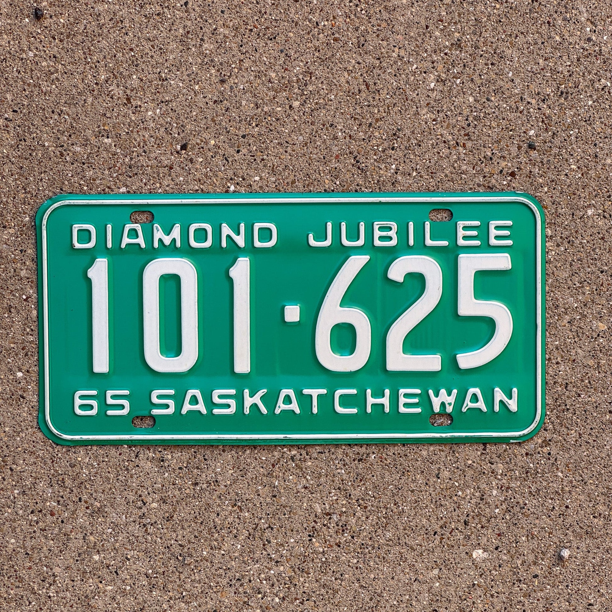 Photo of a 1965 Saskatchewan License Plate Auto Tag Garage Decor Vintage Diamond Jubilee Green 101 625