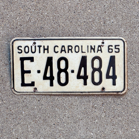 Photo of a 1965 South Carolina License Plate Auto Tag Garage Decor Vintage Palindrome E 48 484 with original patina