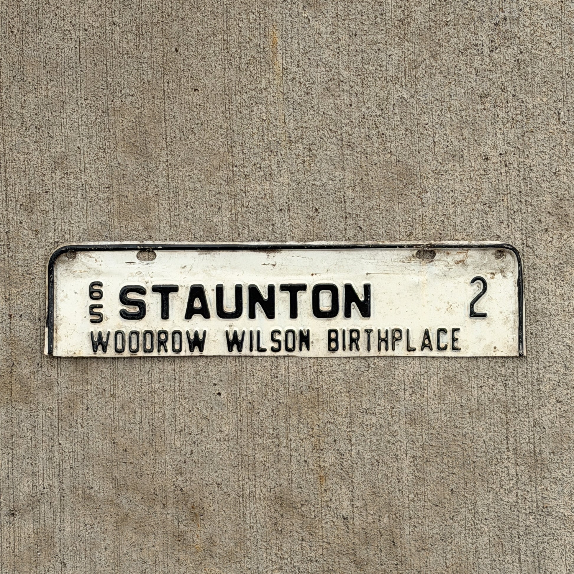 Photo of a 1965 Virginia Tax Strip License Plate Auto Tag Garage Decor Vintage Staunton Woodrow Wilson Birthplace President Low Number 2 with original patina