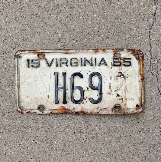 Photo of a 1965 Virginia Taxi Cab License Plate Auto Tag 2 Vintage Garage Low Number Two Digit H 69 with original patina