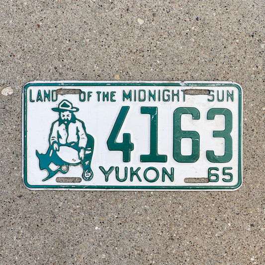 Photo of a 1965 Yukon License Plate Auto Tag Garage Decor Vintage Prospector 4163 with original patina
