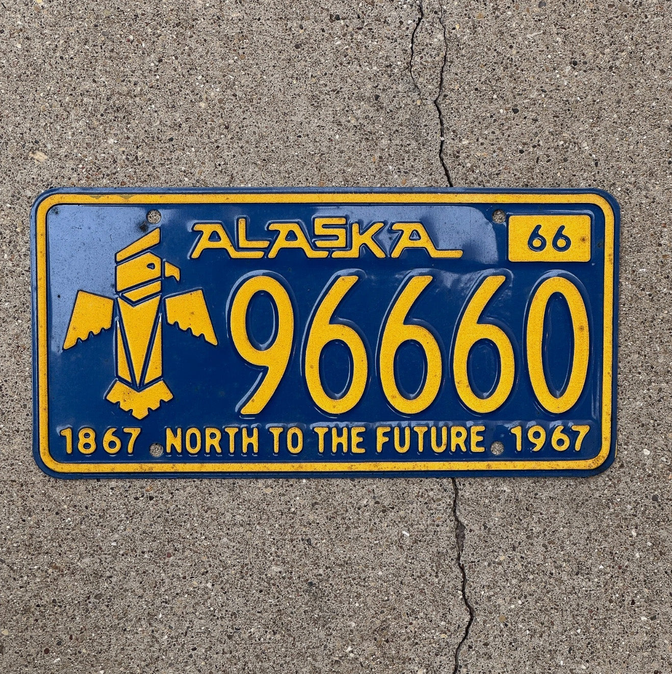 Photo of a 1966 Alaska License Plate Auto Tag Garage Decor Vintage Iconic Totem Repeat Repeating 96660 with original patina