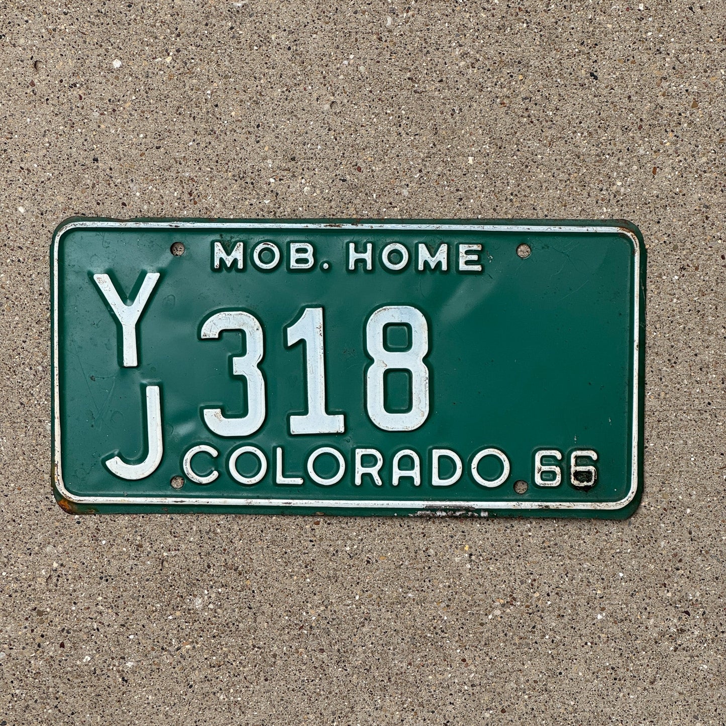 Photo of a 1966 Colorado Mobile Home License Plate Auto Tag Garage Decor Vintage YJ 318
