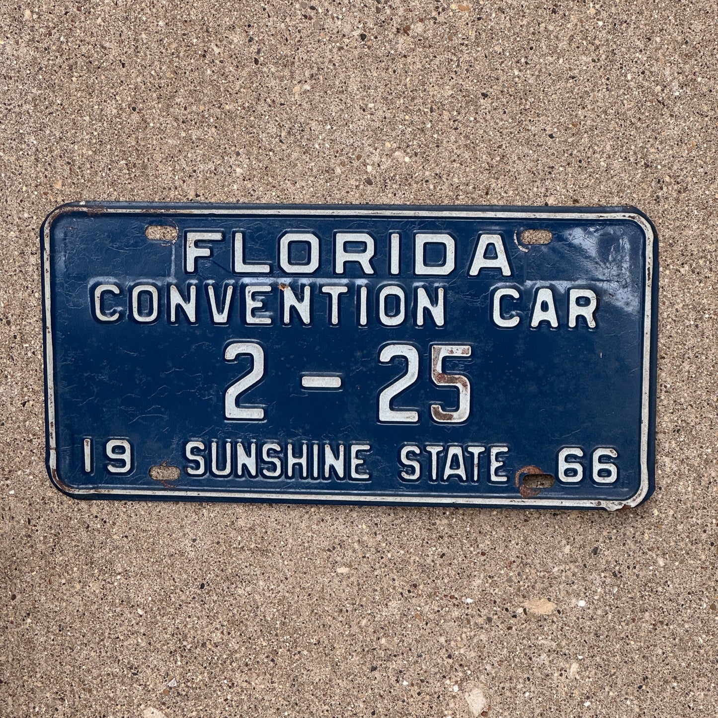 Photo of a 1966 Florida Convention Car License Plate Auto Tag Garage Decor Vintage 2 25 with original patina
