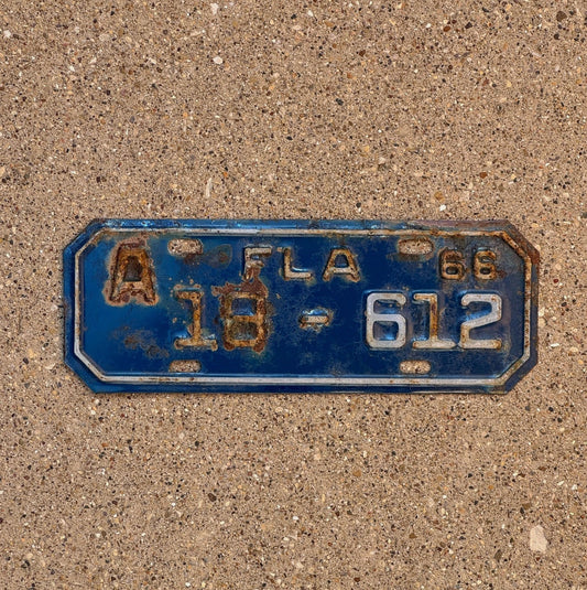 Photo of a 1966 Florida Motorcycle License Plate Auto Tag Garage Decor Vintage Lee County 3 Digit 18 612 with original patina