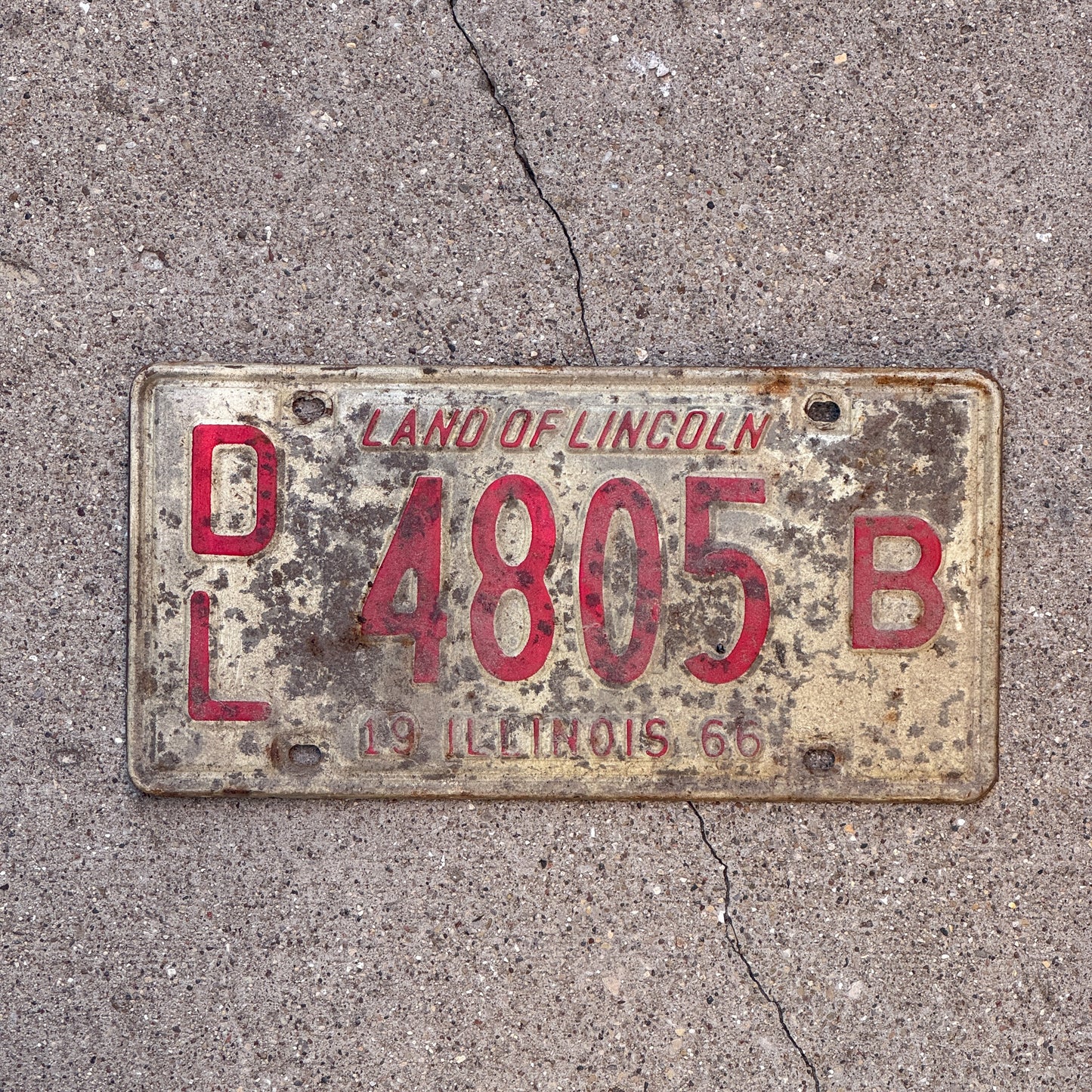 Photo of a 1966 Illinois Dealer License Plate Auto Tag 1 Vintage Garage 4805 B with original patina