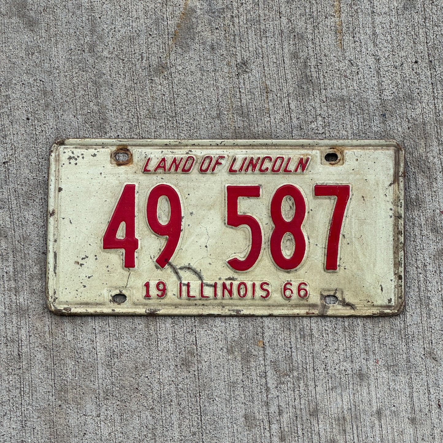 Photo of a 1966 Illinois License Plate Auto Tag 2 Vintage Garage 49 587 with original patina
