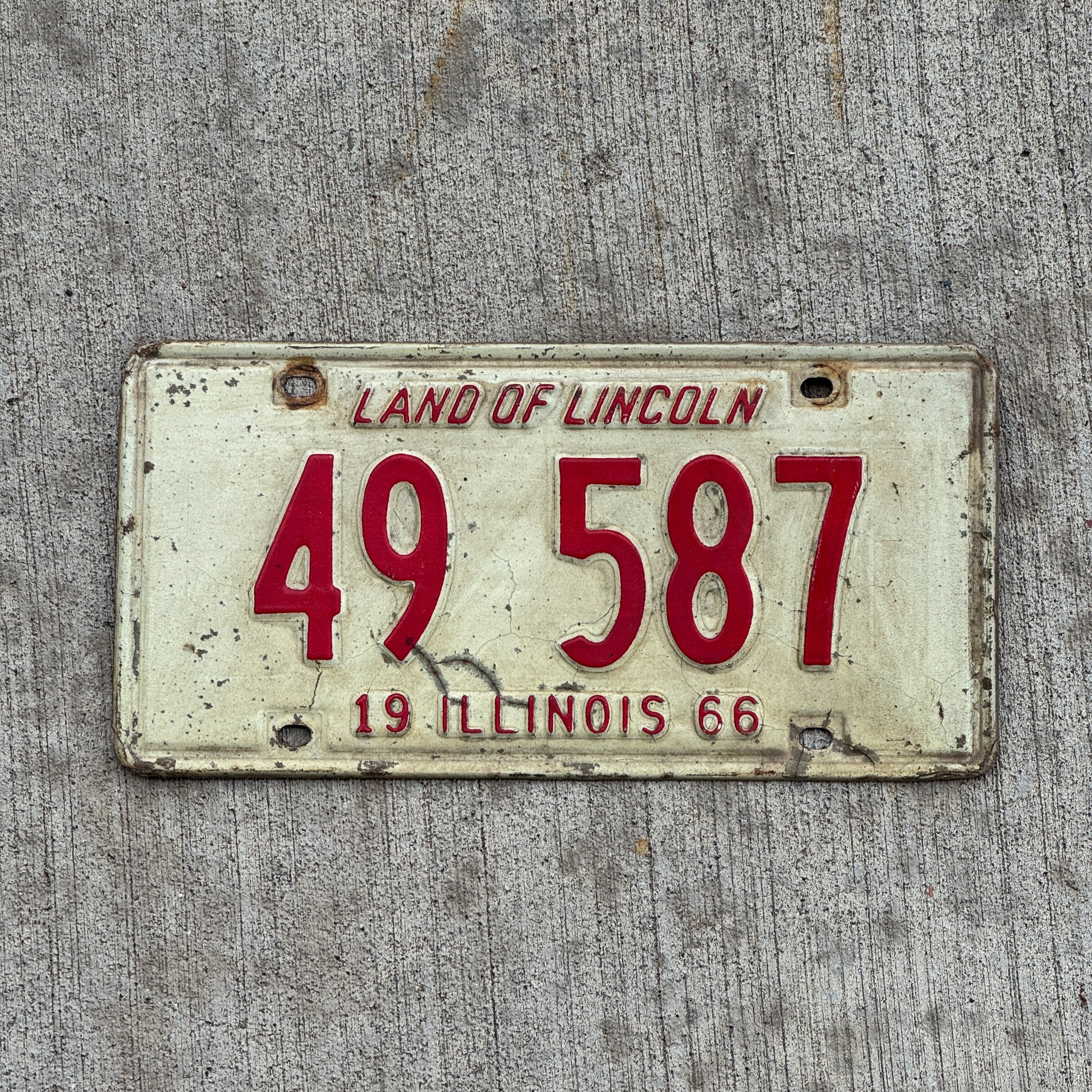 Photo of a 1966 Illinois License Plate Auto Tag 2 Vintage Garage 49 587 with original patina