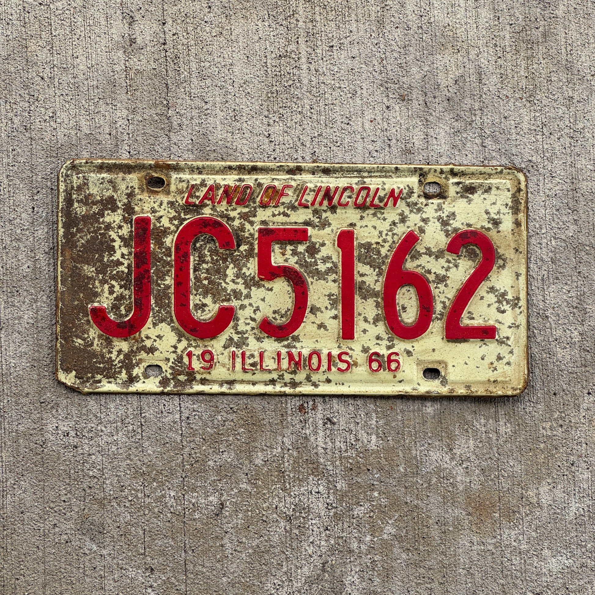 Photo of a 1966 Illinois License Plate Auto Tag 2 Vintage Garage JC 5162 with original patina
