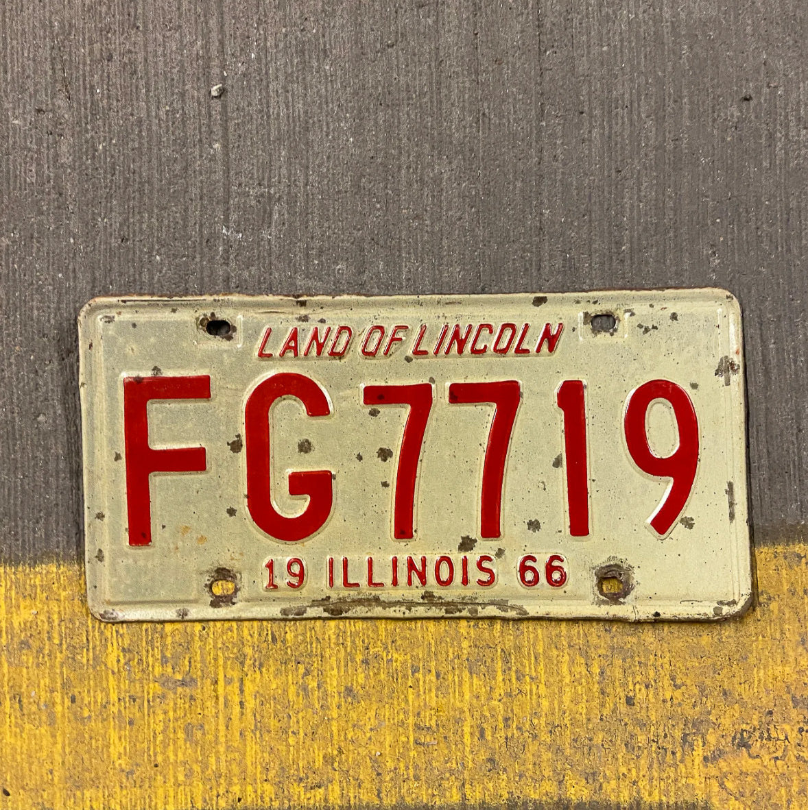 Photo of a 1966 Illinois License Plate Auto Tag Garage Decor Vintage FG 7719 with original patina