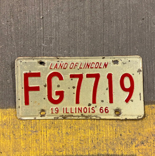 Photo of a 1966 Illinois License Plate Auto Tag Garage Decor Vintage FG 7719 with original patina