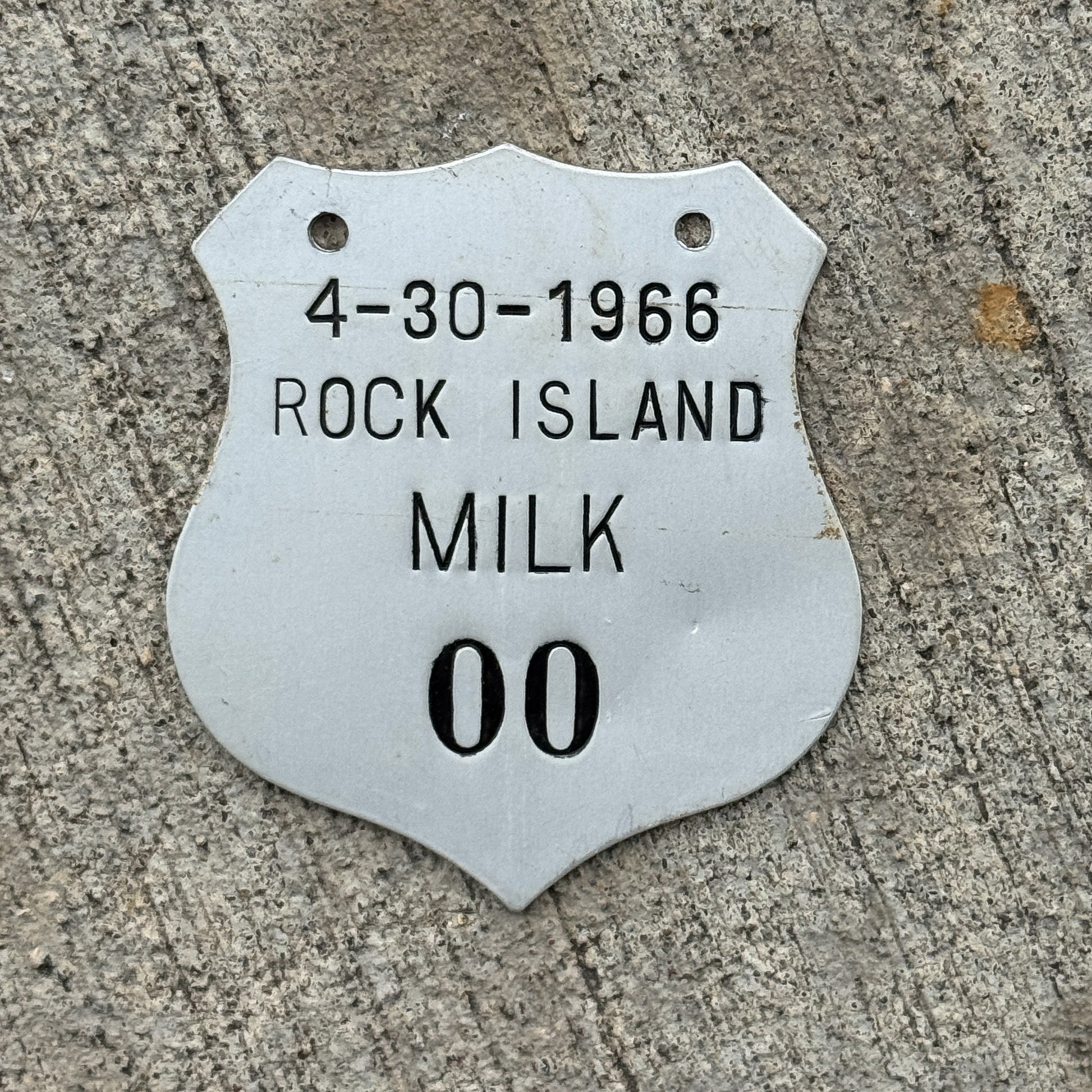 Photo of a 1966 Illinois Milk Vendor Tax Tag License Plate Auto Tag Garage Decor Vintage Badge Low Number 00 with original patina