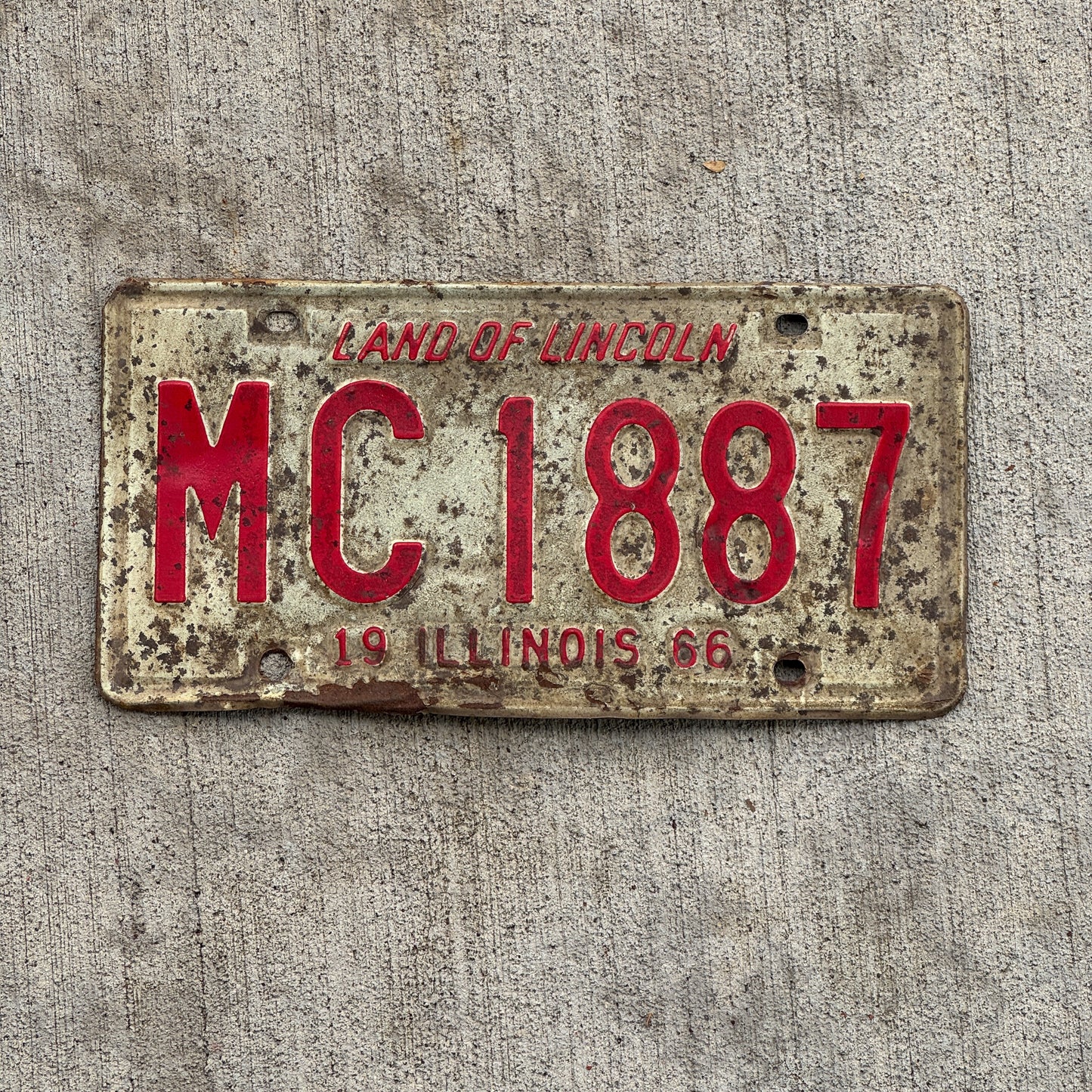 Photo of a 1966 Illinois Truck Mileage Tax License Plate Auto Tag Garage Decor Vintage MC 1887 with original patina