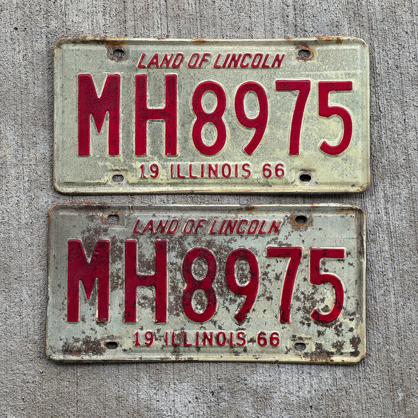 Photo of a 1966 Illinois Truck Mileage Tax License Plate Pair Auto Tag Garage Decor Vintage MH 8975 with original patina