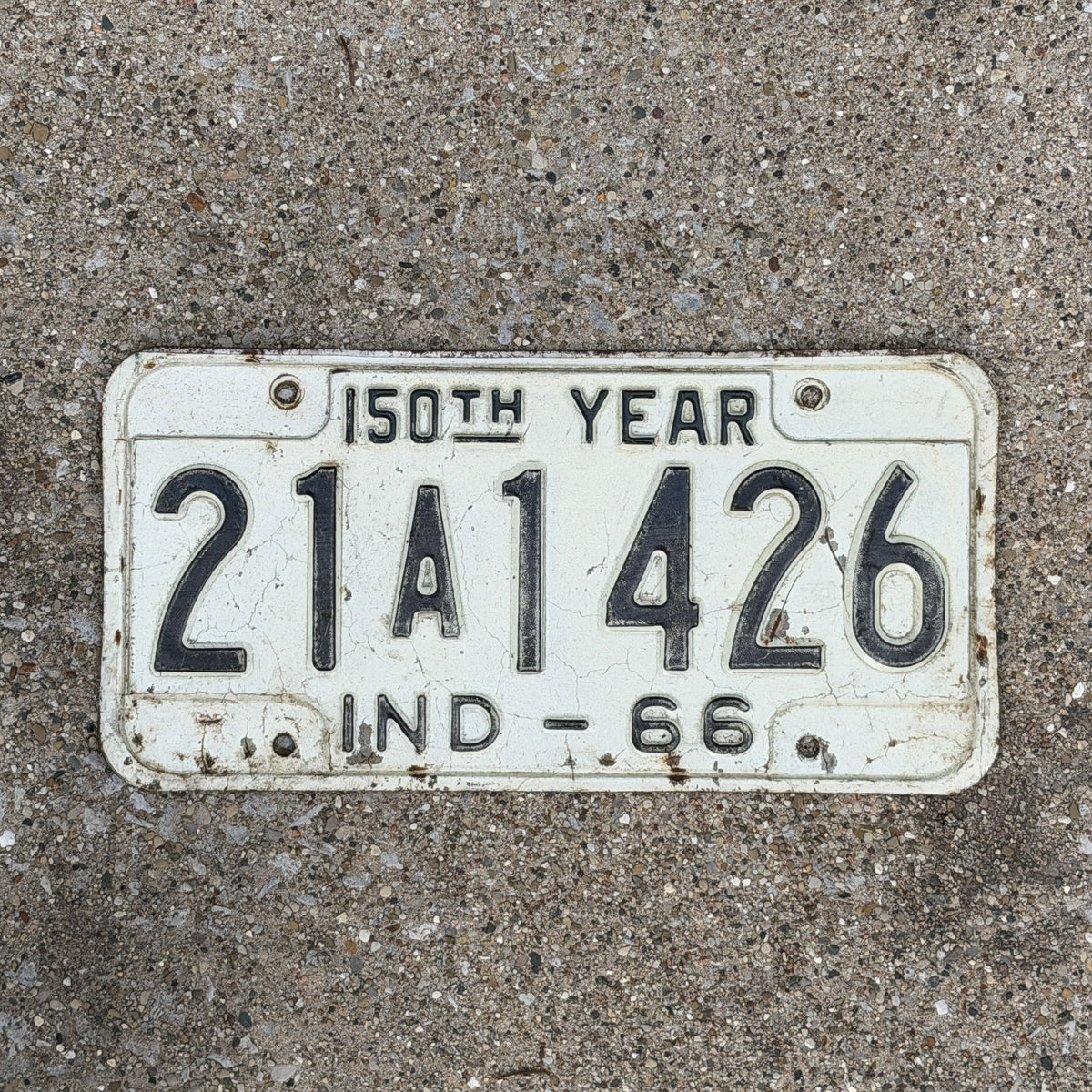 Photo of a 1966 Indiana License Plate Auto Tag Garage Decor Vintage Sesquicentennial 21 A 1426 with original patina
