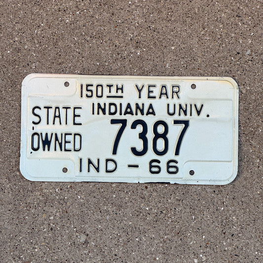 Photo of a 1966 Indiana State Owned License Plate Auto Tag Garage Decor Vintage Indiana University 7387 with original patina