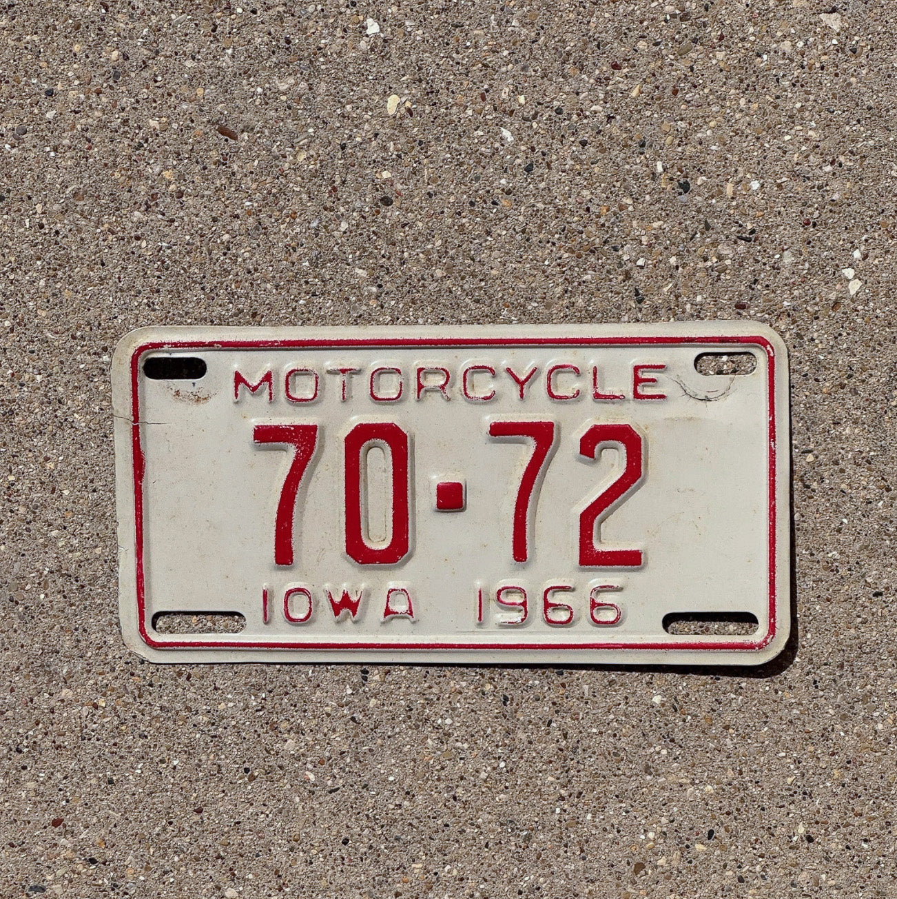Photo of a 1966 Iowa Motorcycle License Plate Auto Tag Garage Decor Low Number Two Digit Muscatine County 70 72 with original patina