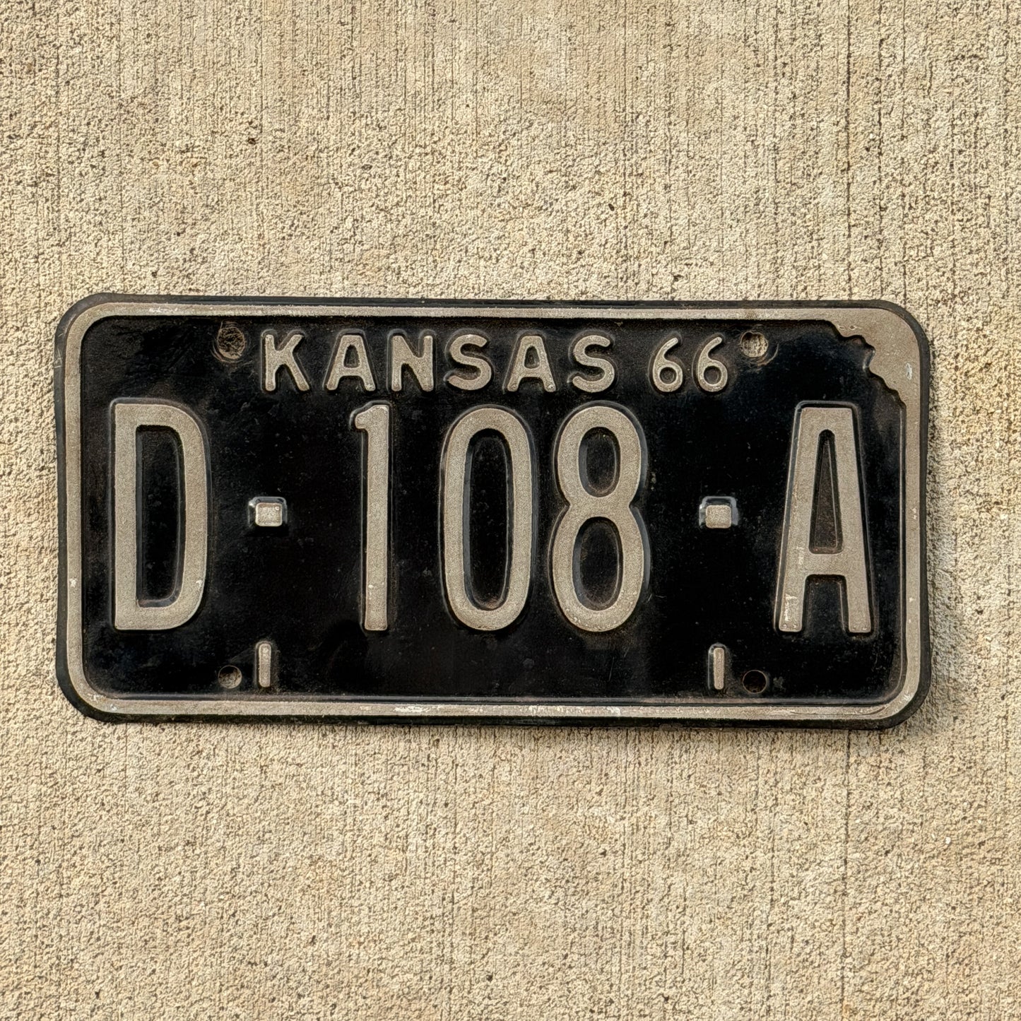 Photo of a 1966 Kansas Dealer License Plate Auto Tag Garage Decor Vintage D 108 A with original patina