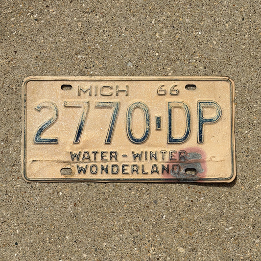 Photo of a 1966 Michigan Commercial License Plate Auto Tag Garage Decor Vintage 2770 DP with original patina