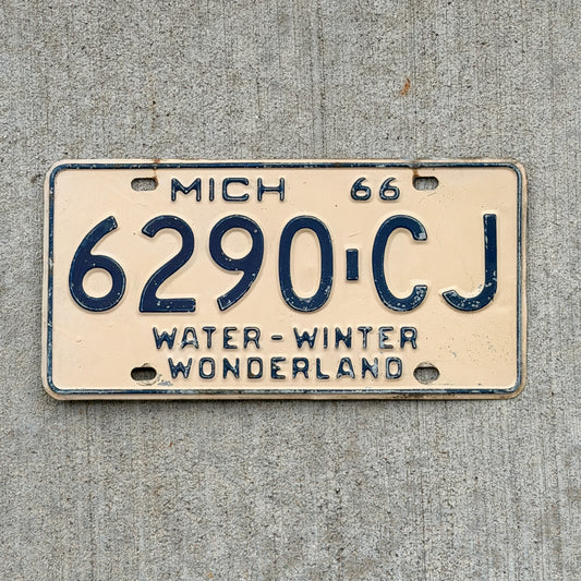 Photo of a 1966 Michigan Commercial License Plate Auto Tag Garage Decor Vintage 6290 CJ with original patina
