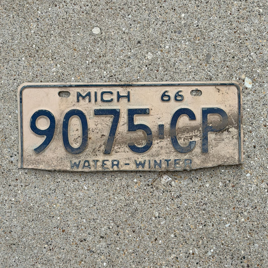 Photo of a 1966 Michigan Commercial License Plate Auto Tag Garage Decor Vintage 9075 CP with original patina