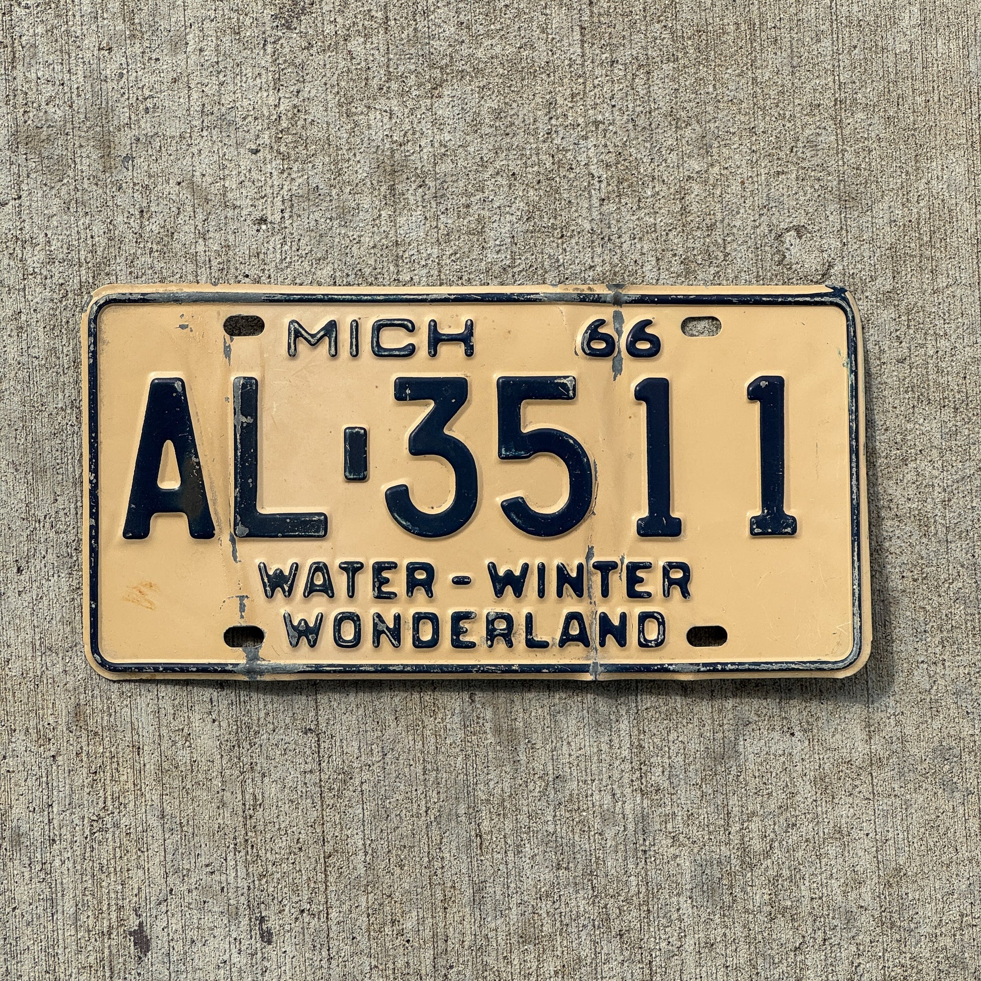 Photo of a 1966 Michigan License Plate Auto Tag Garage Decor Vintage AL 3511 with original patina