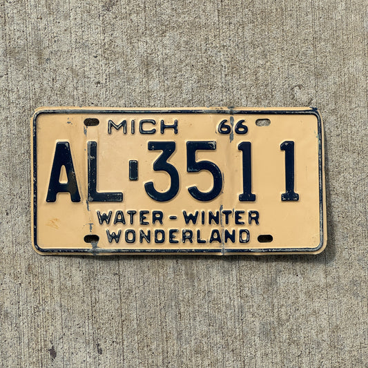 Photo of a 1966 Michigan License Plate Auto Tag Garage Decor Vintage AL 3511 with original patina