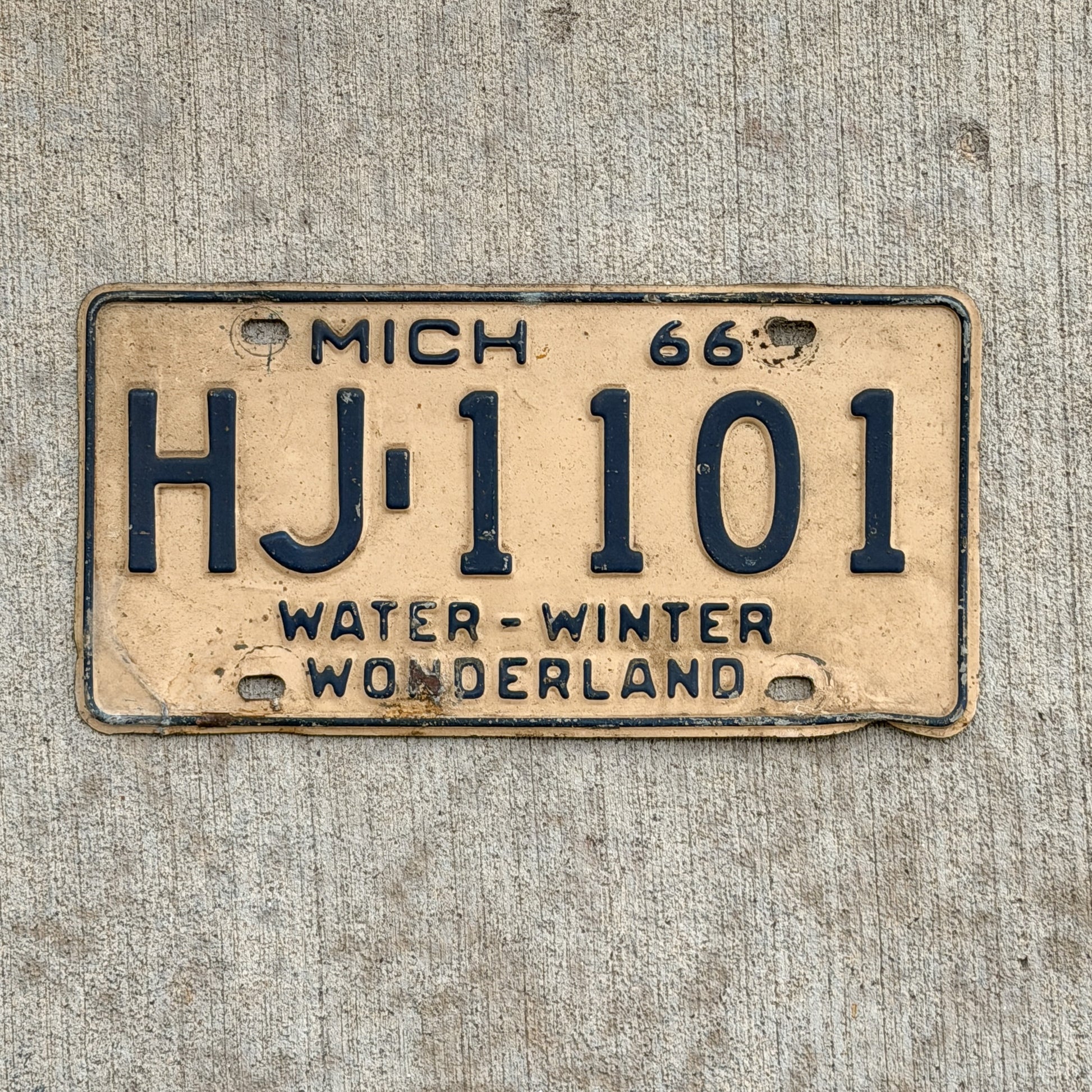 Photo of a 1966 Michigan License Plate Auto Tag Garage Decor Vintage HJ 1101 with original patina