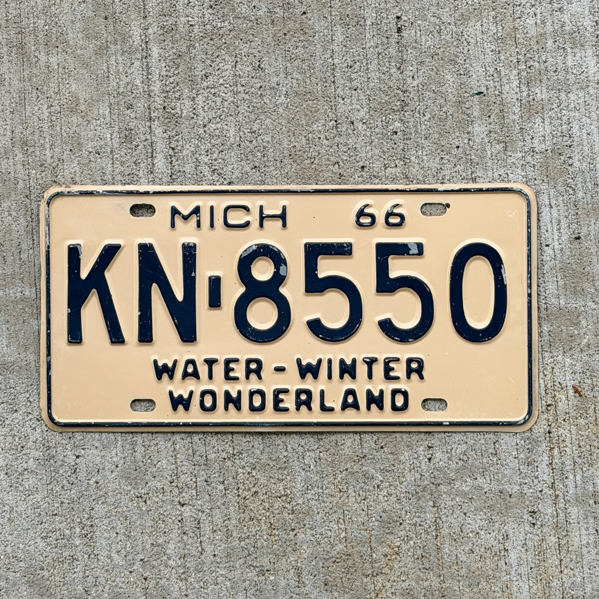 Photo of a 1966 Michigan License Plate Auto Tag Garage Decor Vintage KN 8550 with original patina