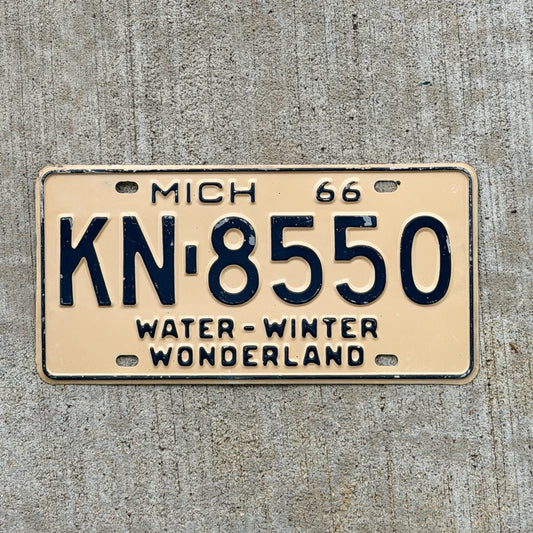 Photo of a 1966 Michigan License Plate Auto Tag Garage Decor Vintage KN 8550 with original patina