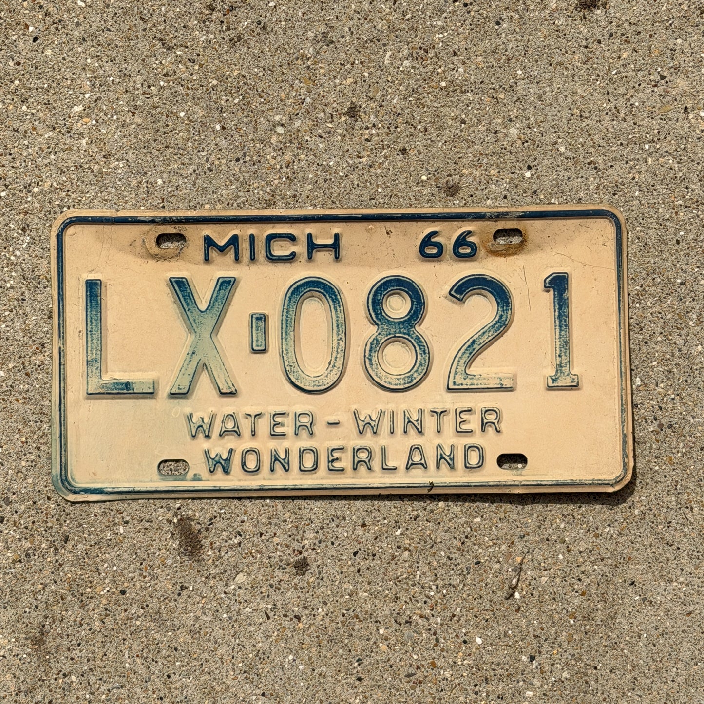 Photo of a 1966 Michigan License Plate Auto Tag Garage Decor Vintage LX 0821 with original patina
