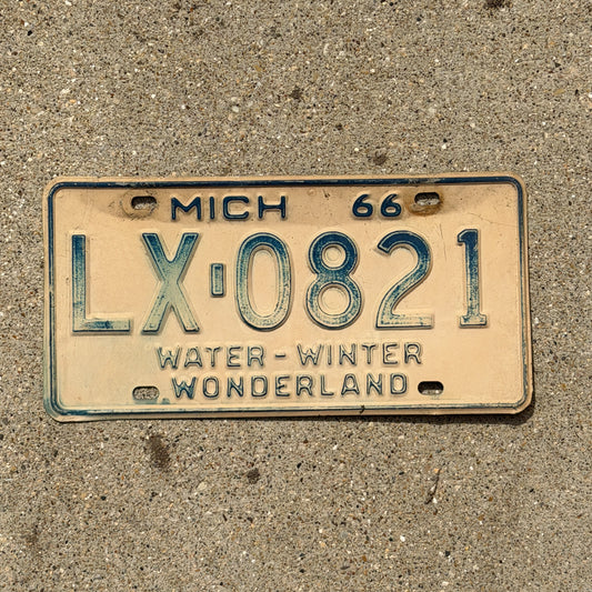 Photo of a 1966 Michigan License Plate Auto Tag Garage Decor Vintage LX 0821 with original patina