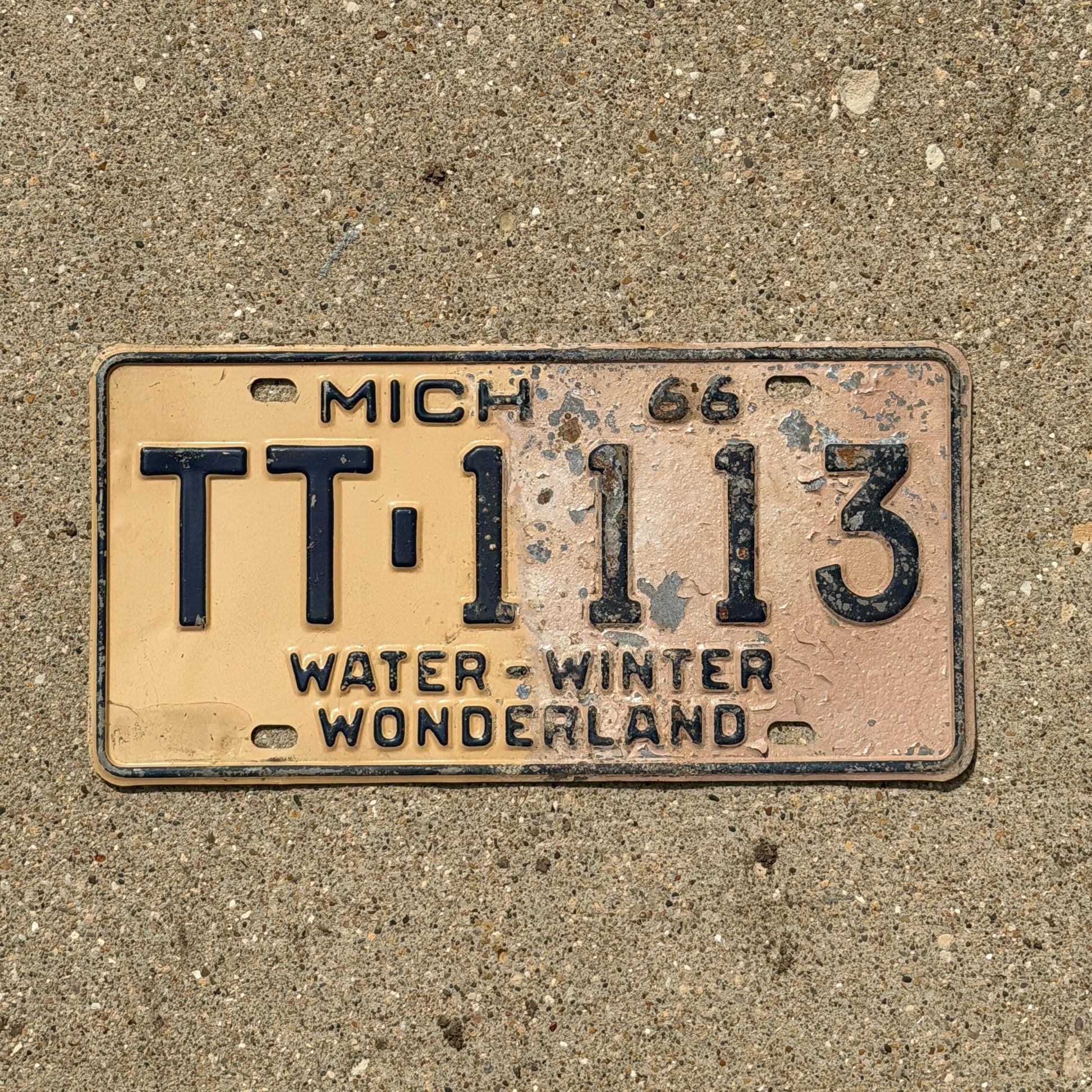 Photo of a 1966 Michigan License Plate Auto Tag Garage Decor Vintage Repeat Repeating TT 1113 with original patina
