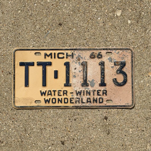 Photo of a 1966 Michigan License Plate Auto Tag Garage Decor Vintage Repeat Repeating TT 1113 with original patina