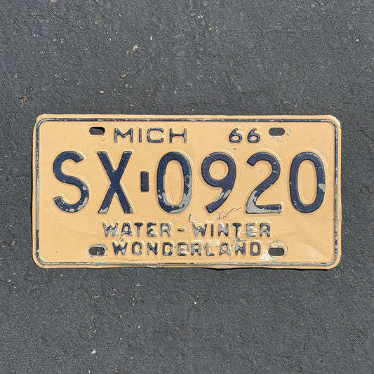 Photo of a 1966 Michigan License Plate Auto Tag Garage Decor Vintage SX 0920 with original patina