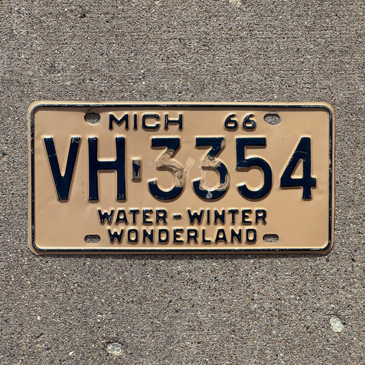 Photo of a 1966 Michigan License Plate Auto Tag Garage Decor Vintage VH 3354 with original patina