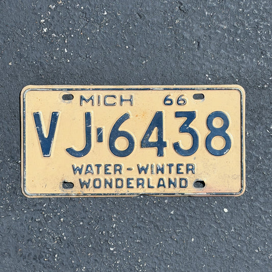 Photo of a 1966 Michigan License Plate Auto Tag Garage Decor Vintage VJ 6438 with original patina