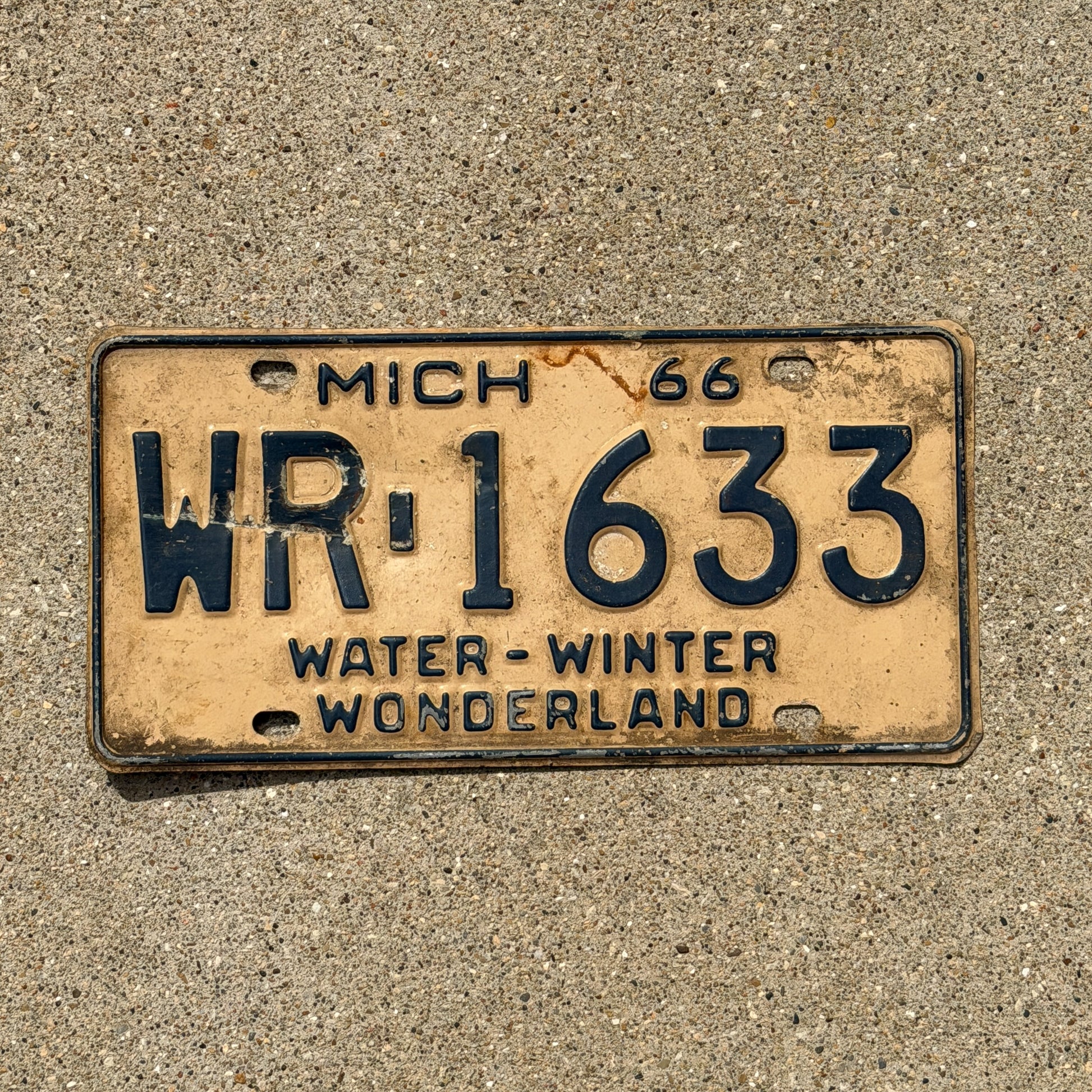Photo of a 1966 Michigan License Plate Auto Tag Garage Decor Vintage WR 1633 with original patina