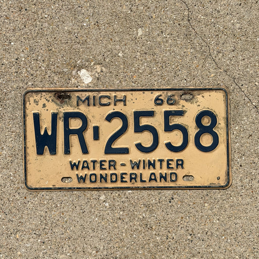 Photo of a 1966 Michigan License Plate Auto Tag Garage Decor Vintage WR 2558 with original patina