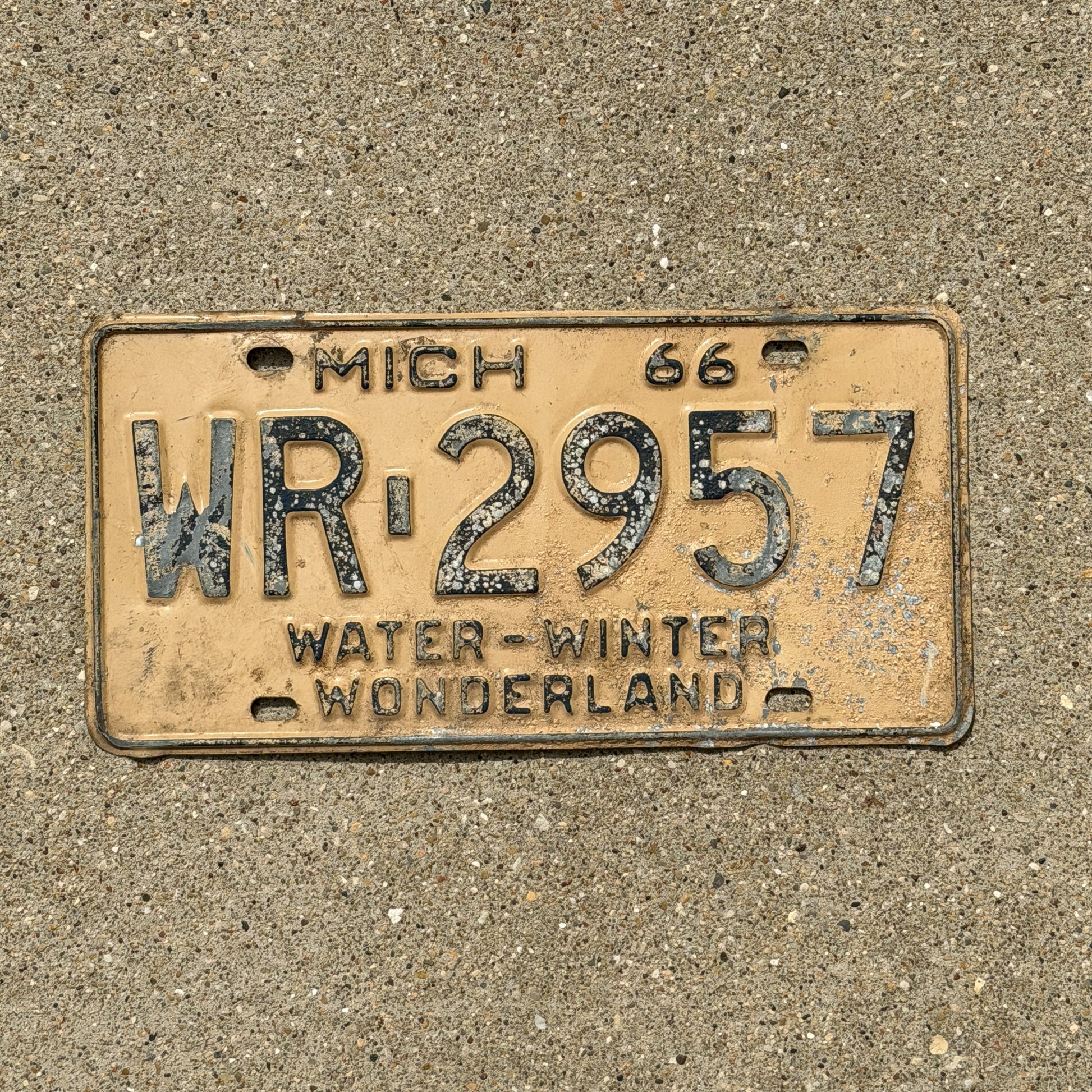 Photo of a 1966 Michigan License Plate Auto Tag Garage Decor Vintage WR 2957 with original patina