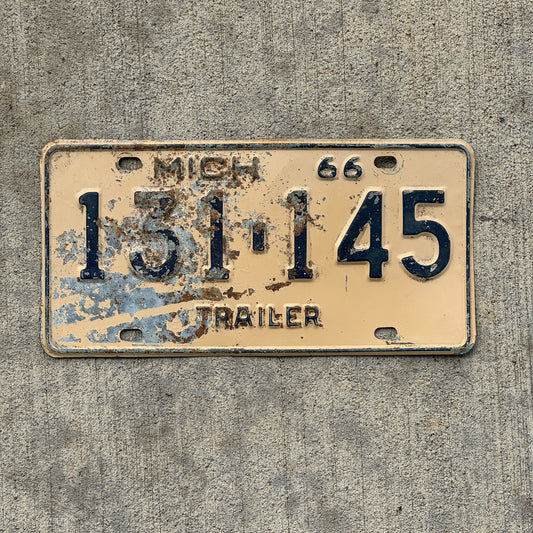 Photo of a 1966 Michigan Trailer License Plate Auto Tag Garage Decor Vintage 131 145 with original patina