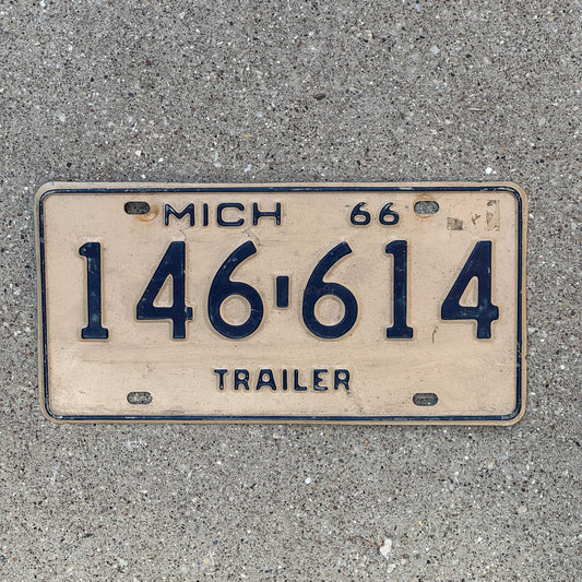 Photo of a 1966 Michigan Trailer License Plate Auto Tag Garage Decor Vintage 146 614