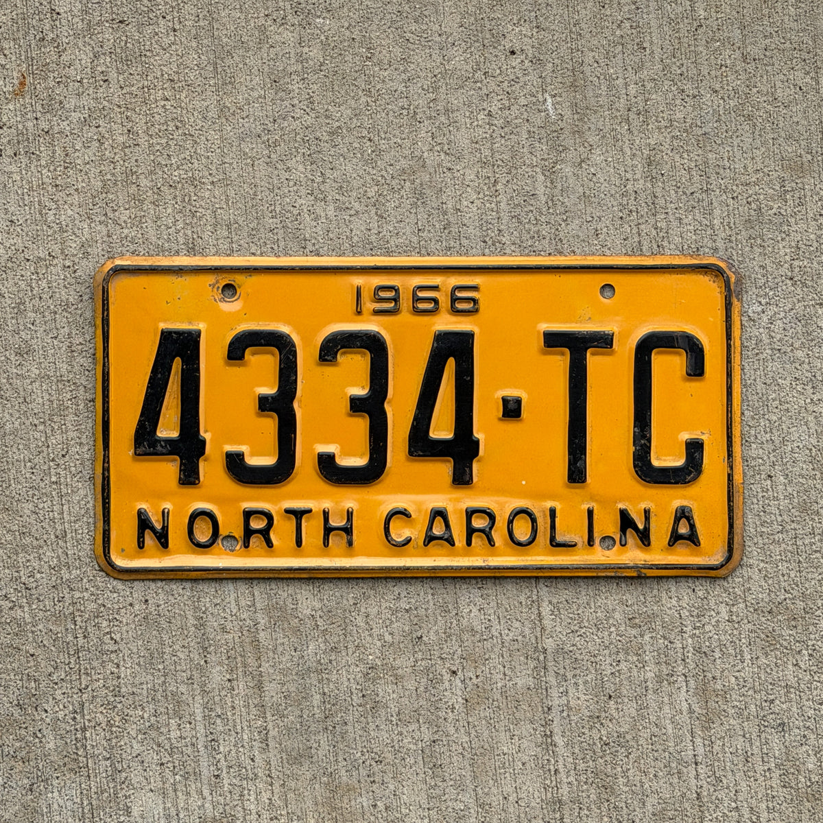 Photo of a 1966 North Carolina Truck License Plate Auto Tag Garage Decor Vintage 4334 TC with original patina