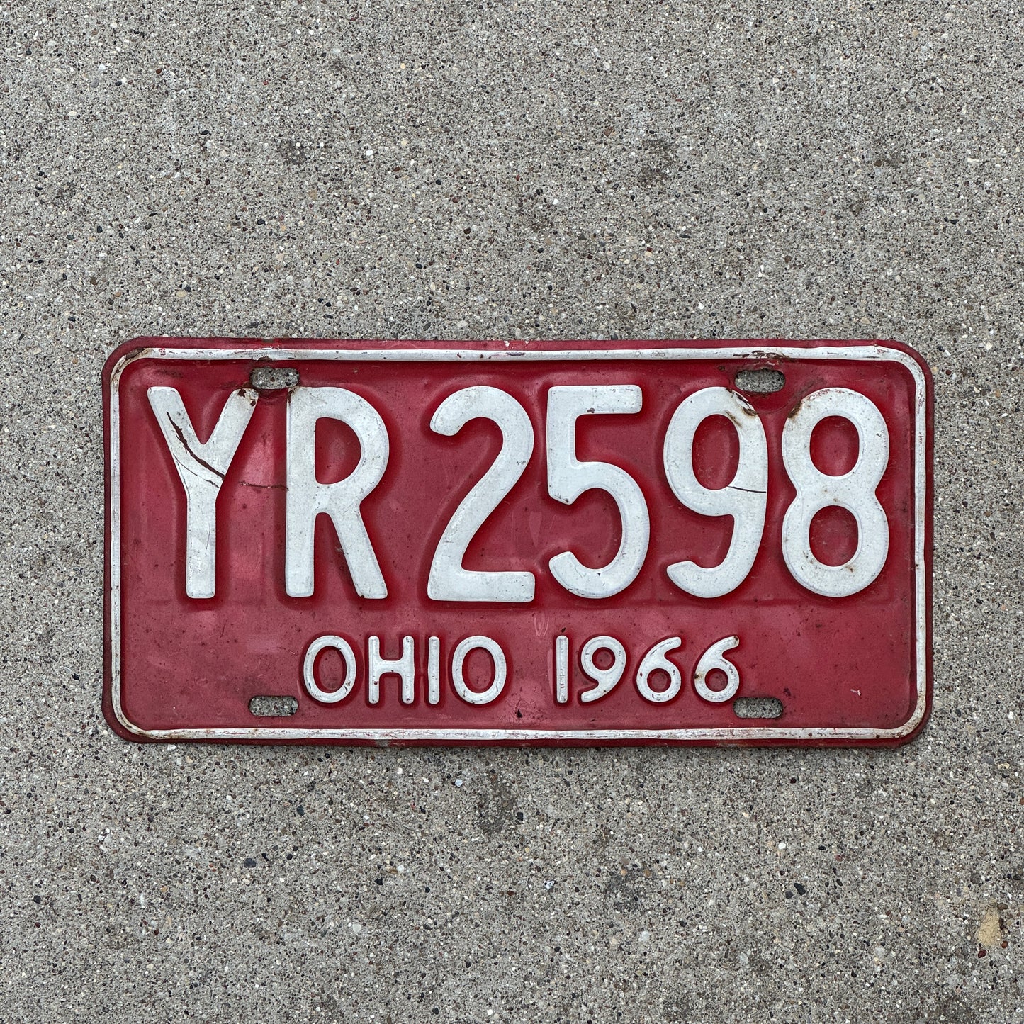 Photo of a 1966 Ohio License Plate Auto Tag 1 Vintage Garage YR 2598 with original patina