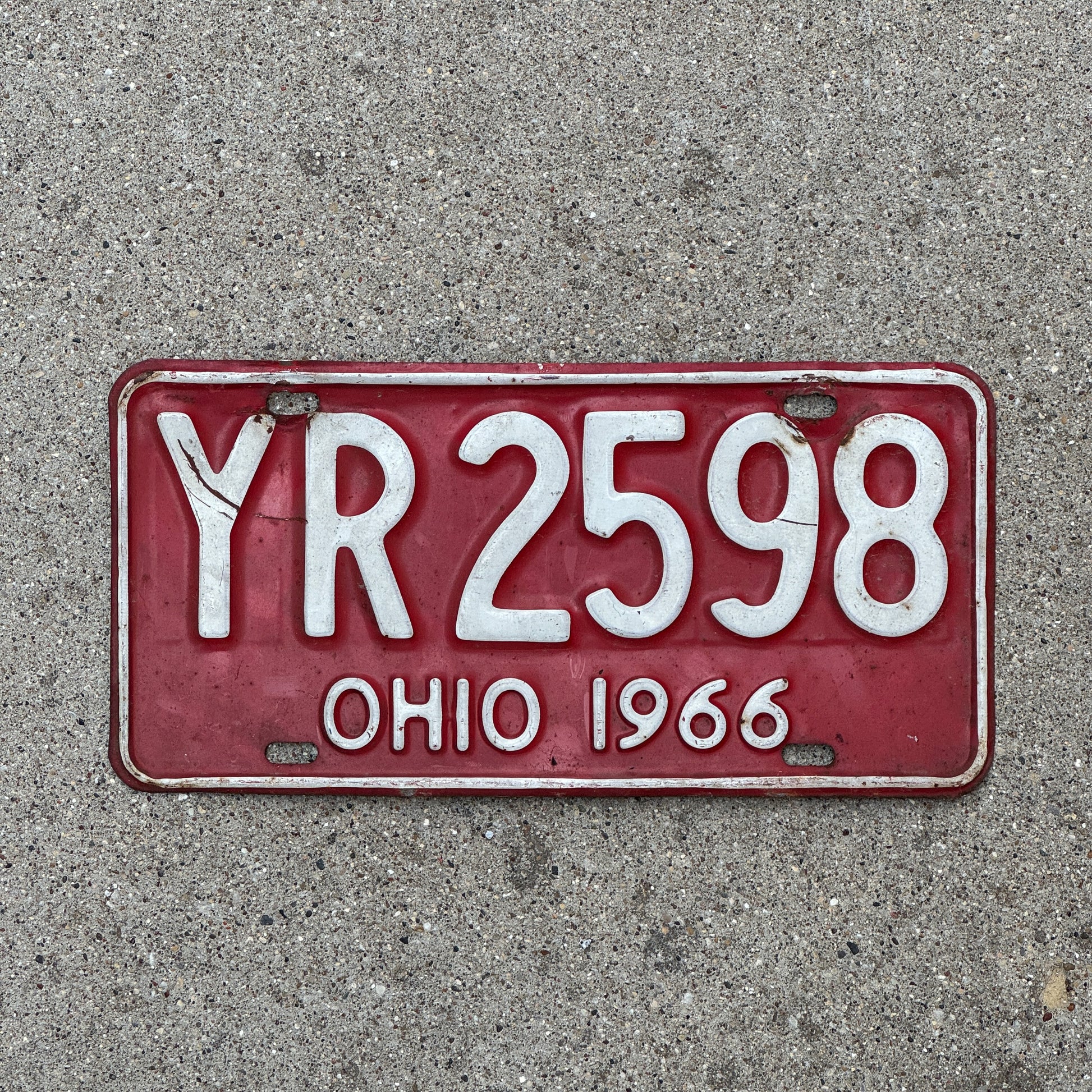 Photo of a 1966 Ohio License Plate Auto Tag 1 Vintage Garage YR 2598 with original patina