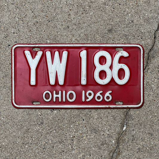 Photo of a 1966 Ohio License Plate Auto Tag 2 Vintage Garage YW 186 with original patina
