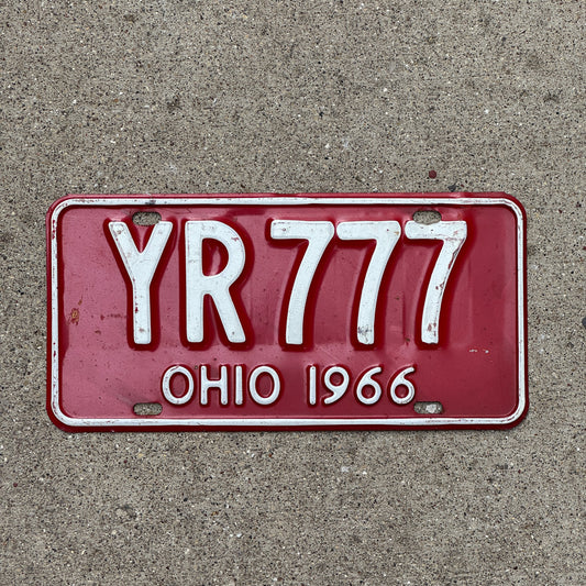 Photo of a 1966 Ohio License Plate Auto Tag Garage Decor Vintage Lucky 7 Repeat Repeating YR 777 with original patina
