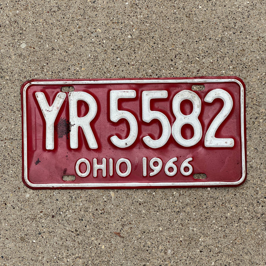 Photo of a 1966 Ohio License Plate Auto Tag Garage Decor Vintage YR 5582 with original patina